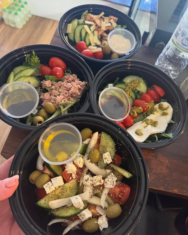 A Greek feta salad bowl with tomato, cucumber and olives